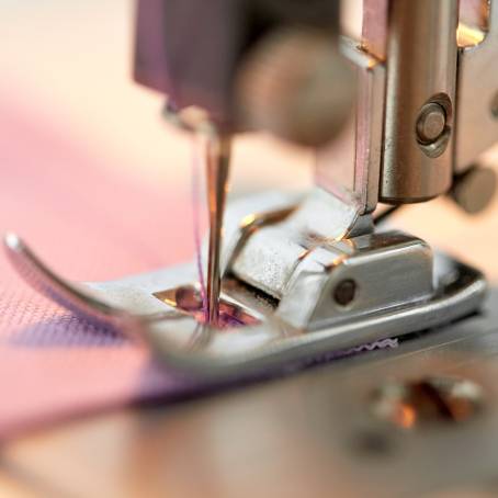 CloseUp on Craftsmanship Needle and Thread in a Sewing Machine