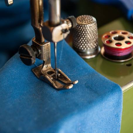 In Focus Needle and Thread in a Sewing Machine CloseUp