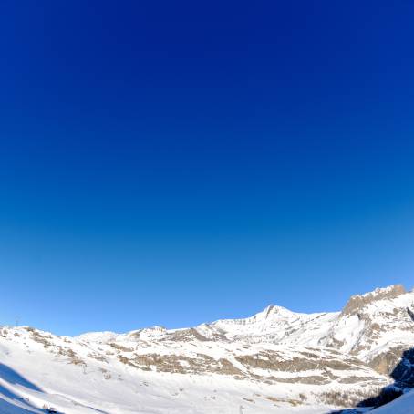 Frozen Peaks High Mountains Under a Winter Blanket