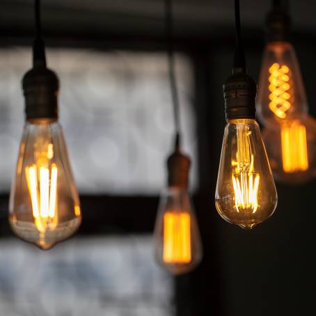 Elegant Light Vintage Hanging Bulb Against a Dark Backdrop