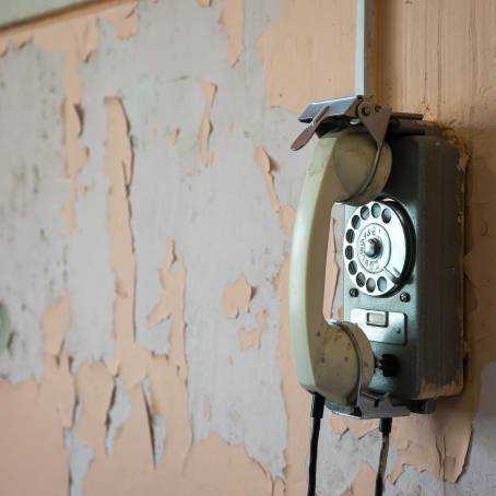 Echoes of the Past An Old Phone on the Building Wall