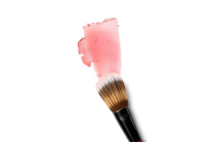 Vibrant Red Eyeshadow and Blush Brush Stroke on White Background