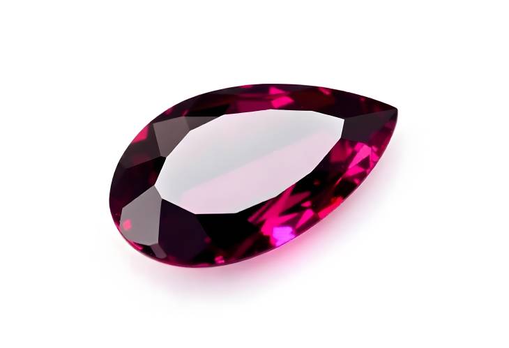 Captivating Tanzanian Rhodolite Garnet Gemstone Pear Cut on White Isolate