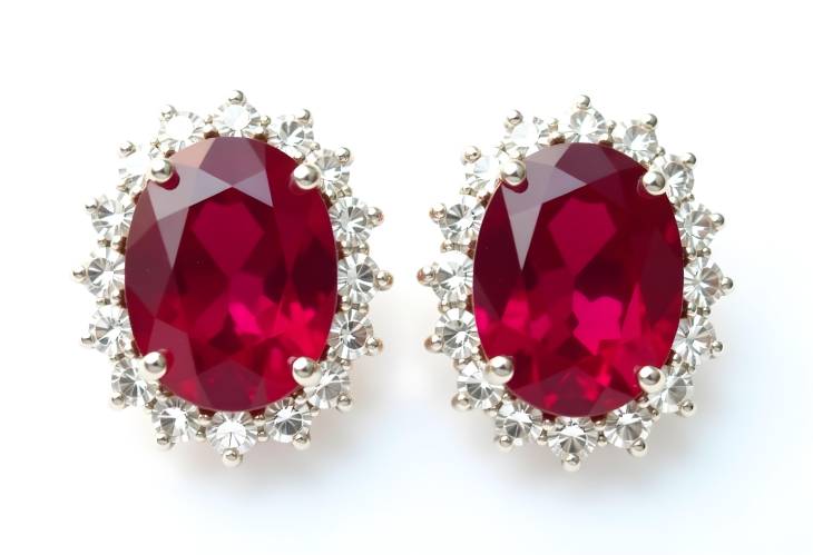 Gorgeous Ruby Earrings Surrounded by Diamonds on White Isolate