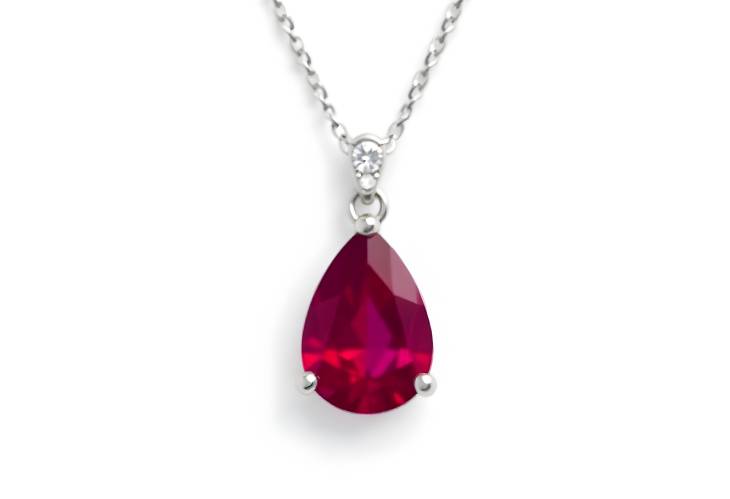 Captivating Pear Shape Ruby and Diamond Pendant in White Gold